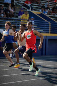 a group of people running on a track